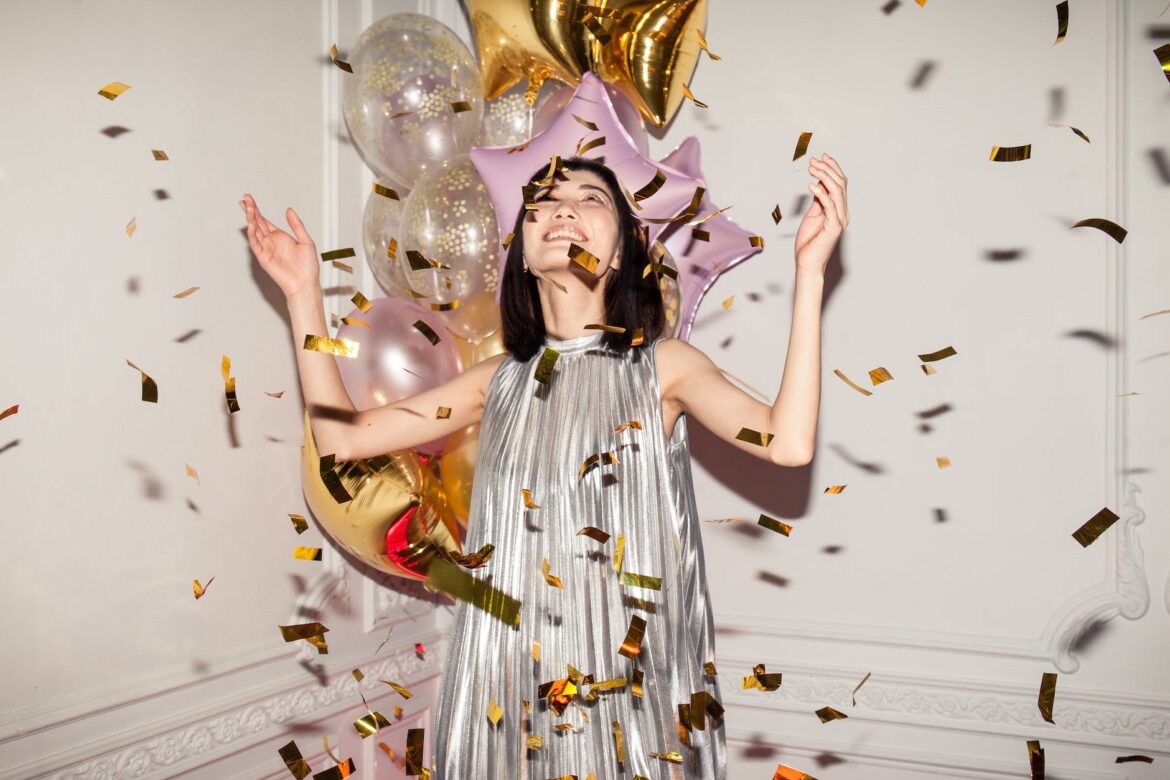 woman looking at falling confetti